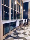 Interior of lovely cafe with white and blue chairs Royalty Free Stock Photo