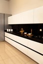 Interior of luxurious modern kitchen white grey cabinets Royalty Free Stock Photo