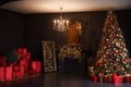 Interior of luxury dark living room with fireplace and chandelier decorated with Christmas tree and gifts Royalty Free Stock Photo