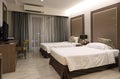 Interior of luxury double beds in hotel bedroom on Mittraphap Road, Nakhon Ratchasima Royalty Free Stock Photo