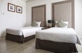 Interior of luxury double beds in hotel bedroom on Mittraphap Road, Nakhon Ratchasima Royalty Free Stock Photo