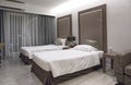 Interior of luxury double beds in hotel bedroom on Mittraphap Road, Nakhon Ratchasima Royalty Free Stock Photo