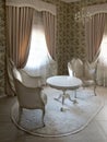 The interior of a luxury hotel room in a classic style. Vintage furniture and drapes Royalty Free Stock Photo