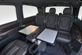 Interior of luxury van with comfortable leather seats and table Royalty Free Stock Photo