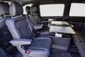Interior of luxury van with comfortable leather seats and table Royalty Free Stock Photo