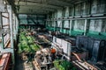 Interior of machinery workshop, large workshop of abandoned factory of synthetic rubber