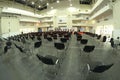 Interior of the main press-conference hall of the International exhibition centre, podium and chairs for people set Royalty Free Stock Photo