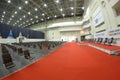 Interior of the main press-conference hall of the International exhibition centre, podium and chairs for people set Royalty Free Stock Photo