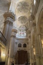 View of large pillars and vaults in interior of Malaga Cathedral, Malaga, Spain