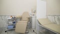 Interior of a medical cabinet at the hospital. Action. Empty medical room with couch and armchair for patients and