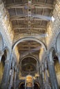 Interior of the medieval church of San Miniato in Florence with stone walls and decorated wooden ceiling Royalty Free Stock Photo