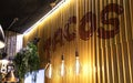 Interior of a Mexican restaurant with the word Tacos on the wall