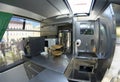 Interior of a military mobile canteen bus for soldiers, cook workplace, seats and tables.