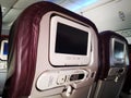 Closeup interior of mini television on flight for passengers on seats inside airplanes view.