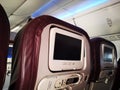 Closeup interior of mini television on flight for passengers on seats inside airplanes view.