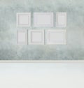 Interior mock up template background with grey stucco wall, white floor and empty blank frame border with copy space Royalty Free Stock Photo