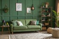 Interior mockup of green wall with green sofa and decor Royalty Free Stock Photo