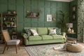 Interior mockup with green wall and sofa Royalty Free Stock Photo