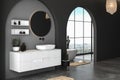 Interior of modern bathroom with concrete and black walls, concrete floor and comfortable white sink Royalty Free Stock Photo