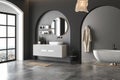 Interior of modern bathroom with concrete and black walls, concrete floor and comfortable white sink Royalty Free Stock Photo