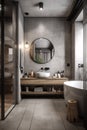 Interior of modern bathroom with gray walls, concrete floor, comfortable bathtub and round mirror Royalty Free Stock Photo