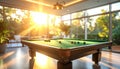 Interior of a modern billiard room with a pool table and bright sunlight streaming in game room Royalty Free Stock Photo