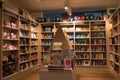 Interior of a modern bookshop with wooden shelves full of books. Royalty Free Stock Photo