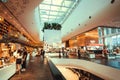 Interior of modern bookstore in huge shopping mall with customers and book readers Royalty Free Stock Photo