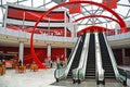 Interior of a modern building with escalators and glass roof. Entrance of Ferrari World..07/09/2013 - Abu Dhabi, UAE Royalty Free Stock Photo