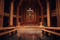 Interior of a modern church with wooden pews and red flowers adorning the altar under crucifix Royalty Free Stock Photo