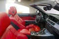 Interior of a modern convertible car with red leather seats Royalty Free Stock Photo