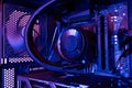 Interior of a modern desktop computer with liquid cooled processor, motherboard, cooling fan and internal components, illuminated Royalty Free Stock Photo