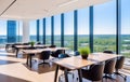 The interior of a modern empty office building with tables and chairs. Floor-to-ceiling windows Royalty Free Stock Photo