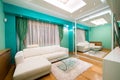Interior of a modern green living room with luxury ceiling light Royalty Free Stock Photo