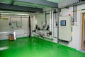 The interior of a modern industrial gas boiler room. Pipelines, water pumps, valves, manometers. Royalty Free Stock Photo