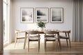 The interior of a modern kitchen and living room with a dining table and frames on the wall Royalty Free Stock Photo