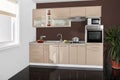 Interior of a modern kitchen, wooden furniture, simple and clean