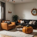 Interior of modern living room with comfortable sofa chair table and pumpkins Royalty Free Stock Photo