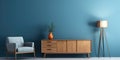 Interior of modern living room with gray wooden sideboard over blue wall. Contemporary room with armchair. Home design