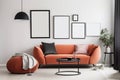 Interior of modern living room with orange sofa, coffee table and three blank picture frames on wall. 3d render, Mockup poster Royalty Free Stock Photo