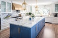 Interior of modern luxurious kitchen classic style. White and blue cabinets with gilded handles, kitchen island with Royalty Free Stock Photo