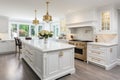 Interior of modern luxurious kitchen classic style. White cabinets with gilded handles, kitchen island with white marble Royalty Free Stock Photo