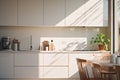 Interior of modern minimalist Scandi style kitchen. White facades, wooden countertop, home appliances, wooden dining Royalty Free Stock Photo