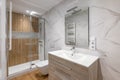 Interior of modern refurbished bathroom with shower with wooden finishing Royalty Free Stock Photo