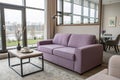 Interior of modern room with lilac sofa and table Royalty Free Stock Photo