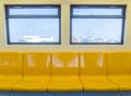 Interior of a modern subway car , sky train yellow seat Royalty Free Stock Photo