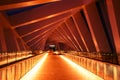 Interior of Modern twisted bridge over the Dubai Water Canal with silhouettes in United Arab Emirates