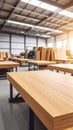 Interior of a modern warehouse with stacked lumber and industrial lighting Royalty Free Stock Photo