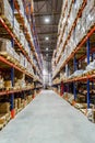 Interior of a modern warehouse storage of retail shop with pallet truck Royalty Free Stock Photo