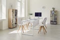 Interior of a modern white business office. Empty light spacious conference room in office with desk, chairs and Royalty Free Stock Photo